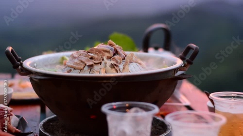 Pork BBQ with mountain view, Pork BBQ dinner with mountain view, cooking and eating Moo Kata, Thai barbecue grill pork with mountain view
