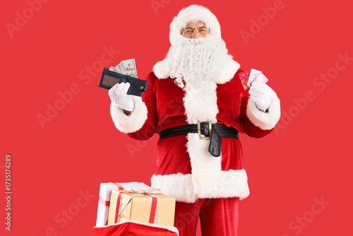 Santa Claus holding gift ca...