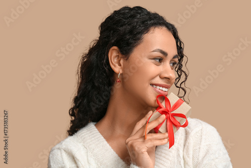 Happy young woman with curl...