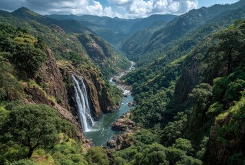 Leinwandbilder Khaki High-angle view of waterfall cascading into valley. Lush, green, mountainous landscape  © Lens