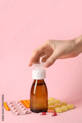 Female hand with bottle of ...
