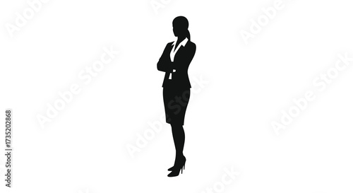 Professional woman in a suit confidently poses striking a powerful silhouette