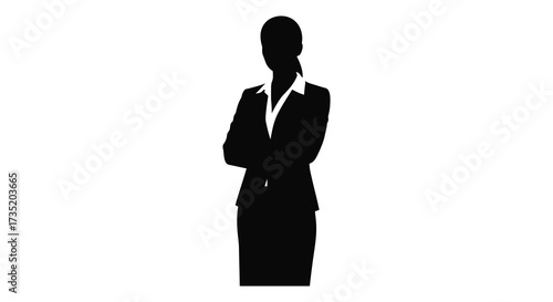Professional woman in a suit standing with arms crossed a striking silhouette
