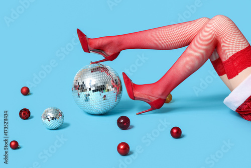 Legs of young woman in red ...