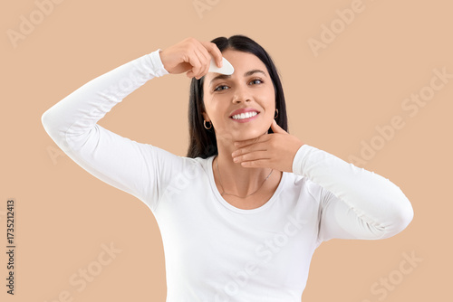 Young woman with gua sha ma...