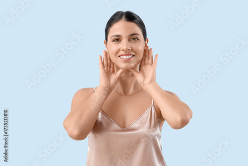 Young woman doing face buil...