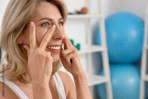 Beautiful woman doing face ...