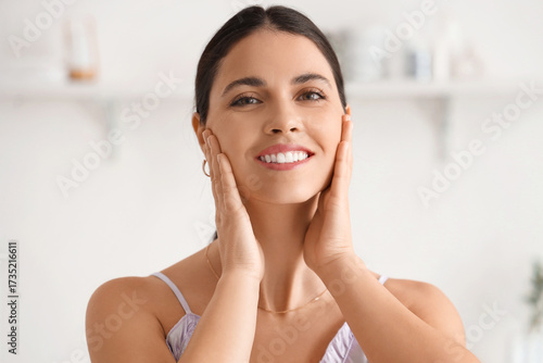 Young woman doing face buil...