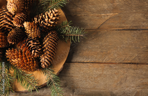 Board with pine cones and f...