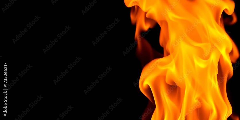 Fototapeta premium Intense orange and yellow flames dancing against a black background, black, power