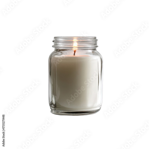 Lit candle in glass jar, warm flame against dark background