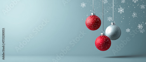 Three festive Christmas balls with snowflakes on blue