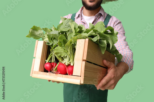 Male farmer with box of rip...