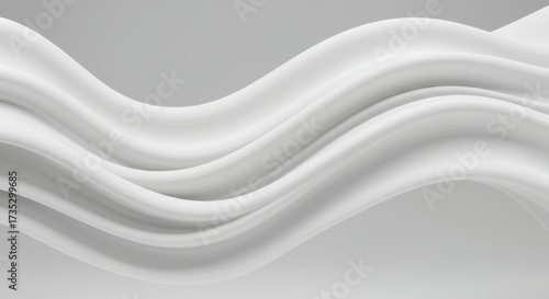 Smooth, flowing white fabric is arranged in graceful waves against a muted gray backdrop, creating a sense of elegance and fluidity, the monochromatic composition and soft lighting enhance the...