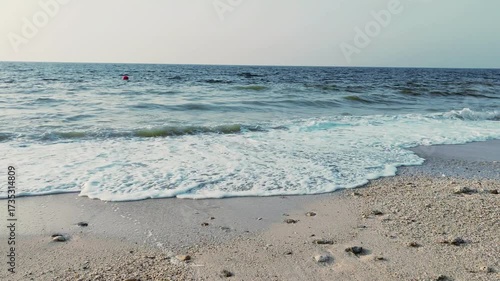 Water waves Sea Shore Beautiful Panorama white sand beach and turquoise water View.
Holiday summer beach background, Wave of sea on White sandy beach.
Enjoy Holiday on Public Beach Heavy Water Waves