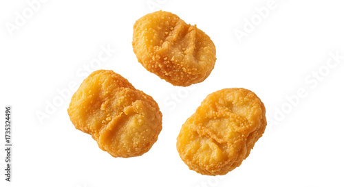 Crispy golden chicken nuggets on a black background studio shot
