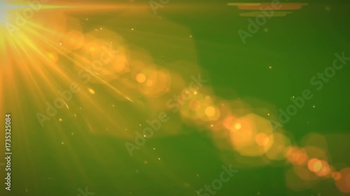 Abstract Warm Sunlight Flare Effect Over a Green Background.