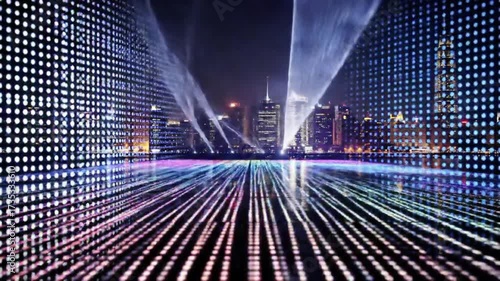 Futuristic city skyline illuminated by glowing digital light grid reflecting on water surface at night in vibrant neon colors, technology background concept seemless looping animation 4k quality video