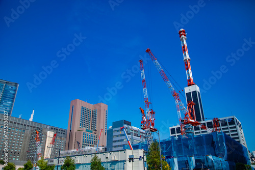 Photography A cityscape of moving crane at the under construction in Tokyo wide shot