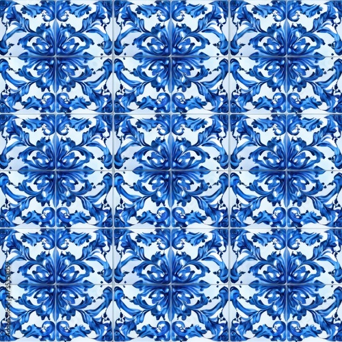blue and white ceramic tiles with intricate symmetrical floral and leaf patterns forming a repeating ornamental design