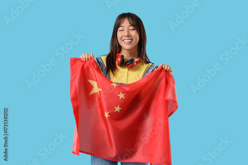 Young Asian woman with flag...