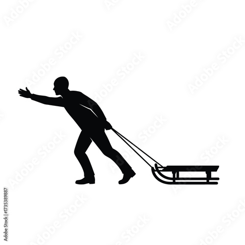 silhouette of a man pulling a sled