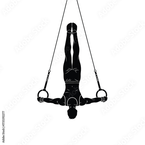 silhouette of a male gymnast on rings