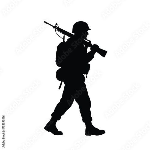 silhouette of a soldier walking with a rifle