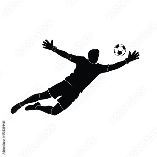 silhouette of a soccer goalkeeper diving to catch the ball