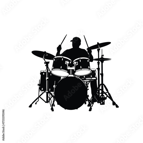 silhouette of a drummer playing drums