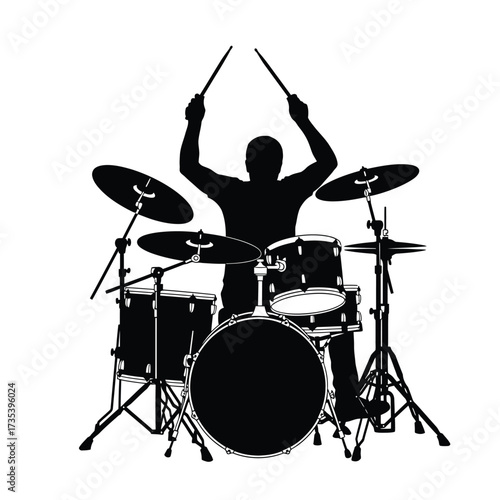 silhouette of a drummer playing drums