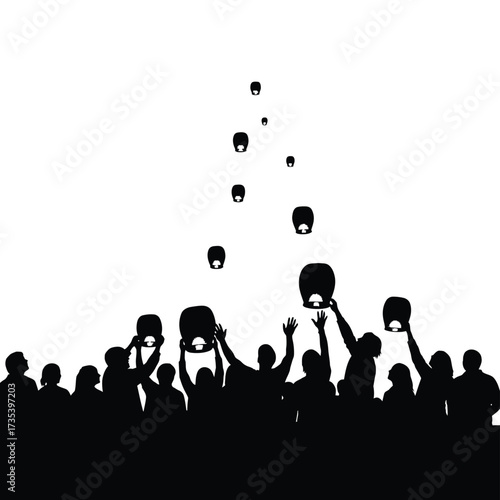 silhouette of a crowd releasing sky lanterns into the night sky