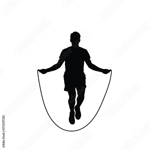 silhouette of a man jumping rope