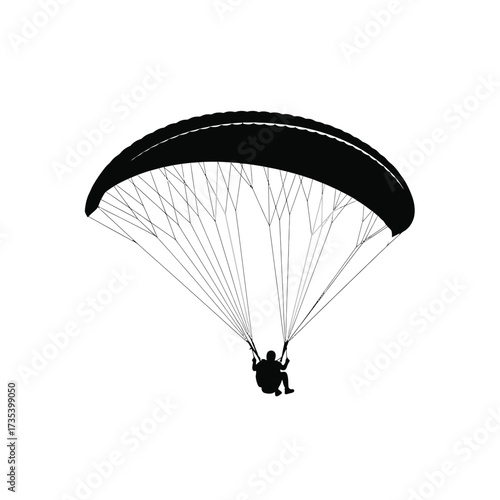 silhouette of a person paragliding
