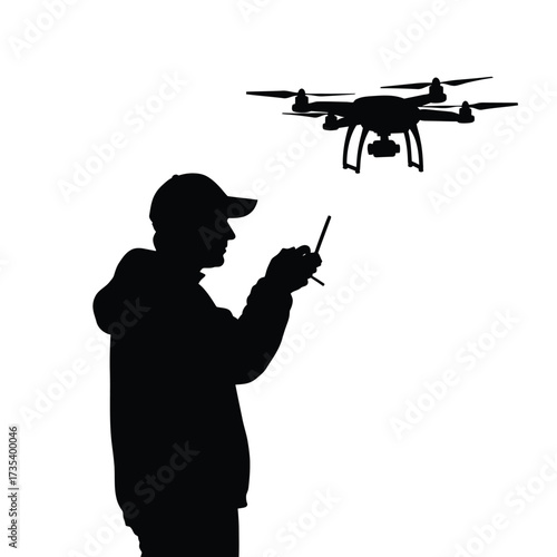 silhouette of a man operating a drone