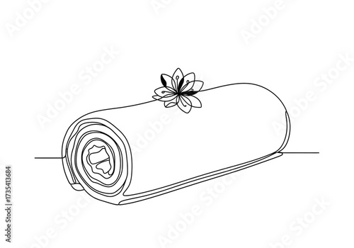 Rolled towel a flower on top, a spa wellness concept for relaxation rejuvenation
