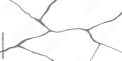 Closeup of cracked white concrete wall texture with an old, abstract broken surface pattern like a map