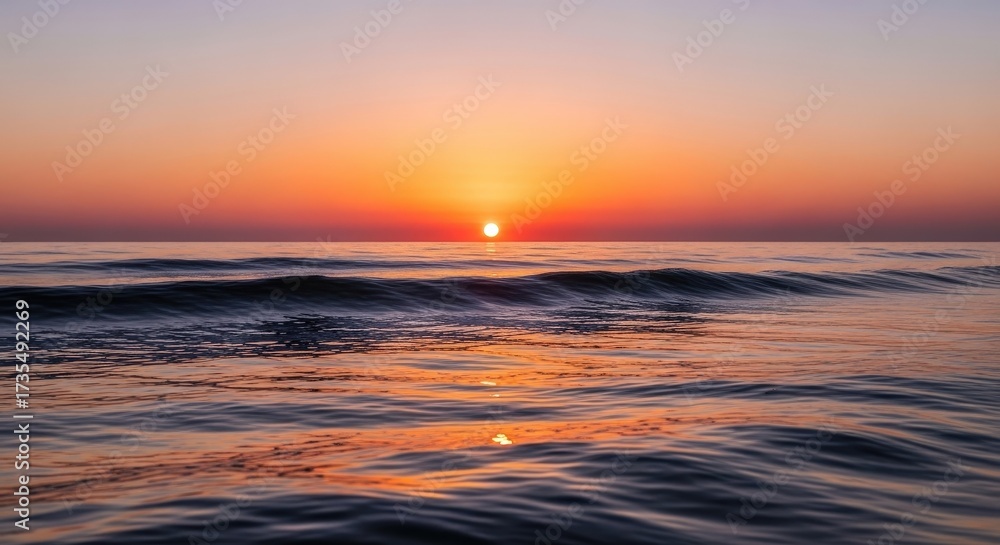 Obraz premium Experience a stunning sunrise over the ocean waves, feel the peace and tranquility wash over you in this captivating coastal scene