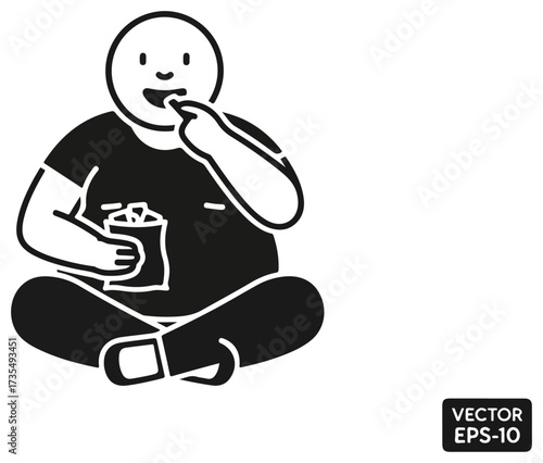 Overweight person eating snack food while sitting cross-legged