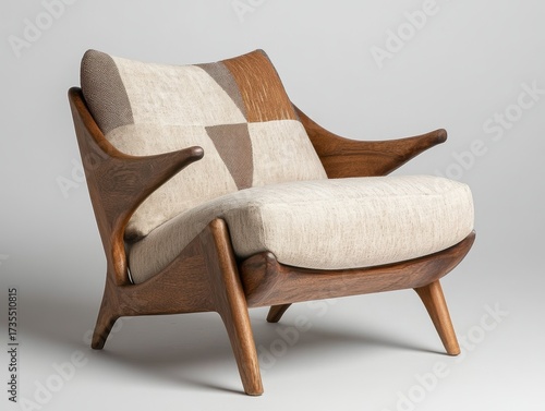 Mid-century modern lounge chair with wood frame and textured upholstery in neutral colors