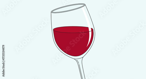 A tilted glass of red liquid against a light blue background.
