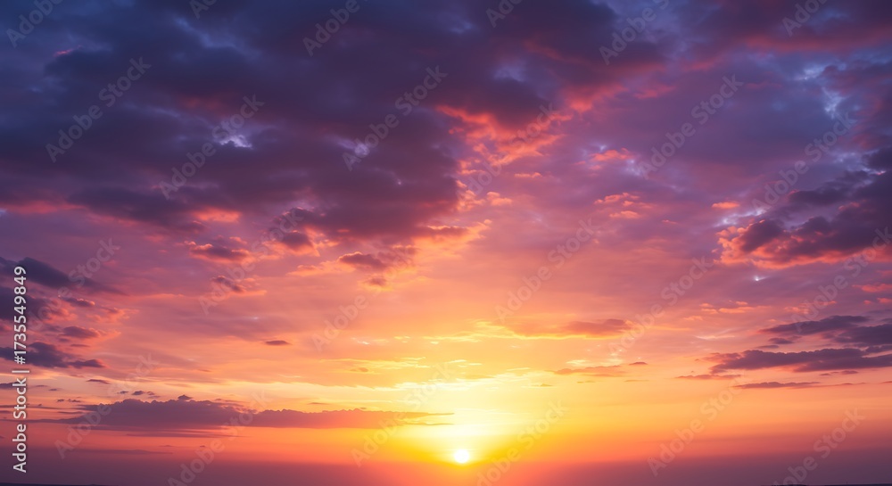 Naklejka premium Vibrant sunset with colorful clouds and radiant sunlight in the sky