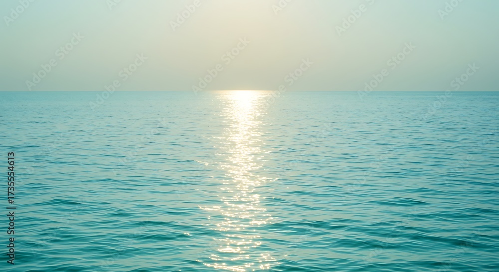 Fototapeta premium Tranquil turquoise ocean under soft sunlight horizon creating a serene seascape