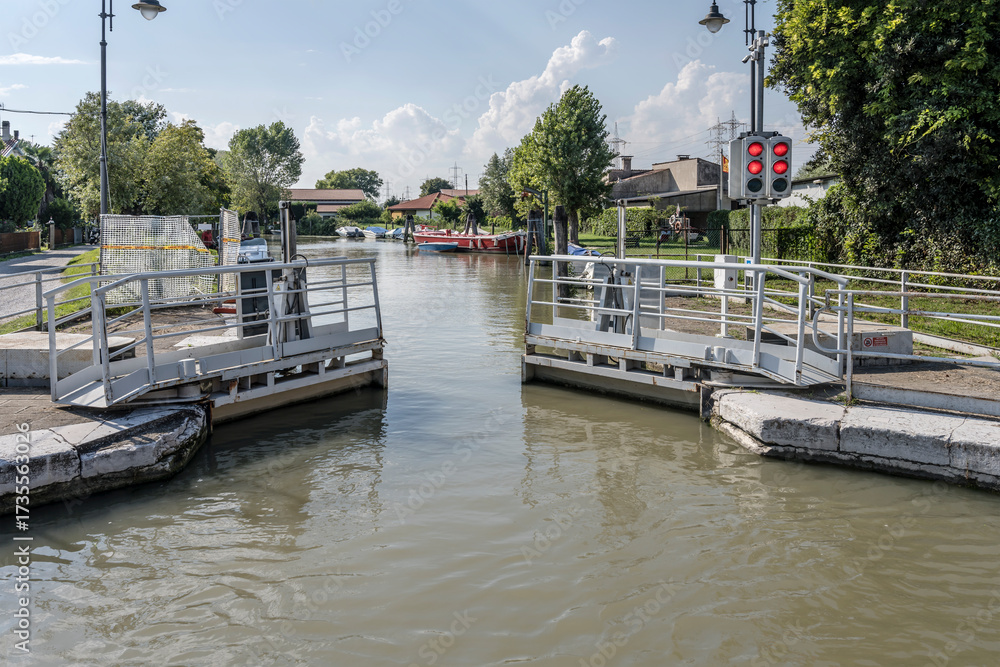 Fototapeta premium lock doors closing on Brenta canal, near Marghera, Italy