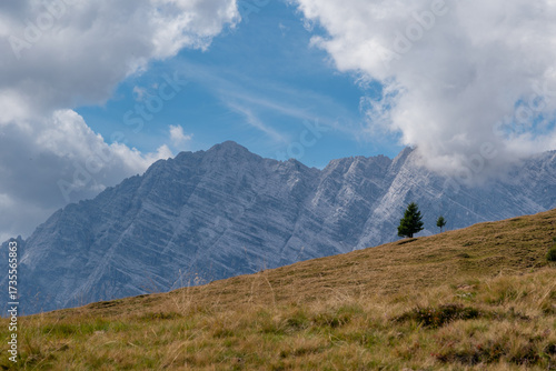 View into the Steinernes Meer limestone plateau with rugged alpine peaks and dramatic clouds