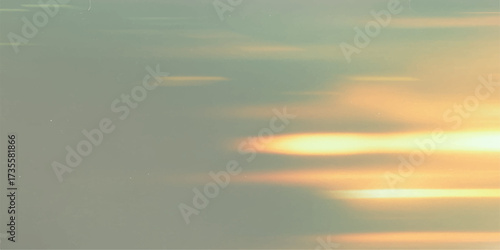 An orange, red, and yellow sunset paints the clouds and sky over the sea, a beautiful display of nature's light at dusk