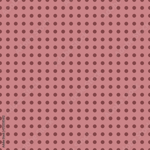 A seamless vector pattern with red-toned polka dots in a grid on a dusty pink background. Ideal for packaging, fabric, and subtle decorative uses.