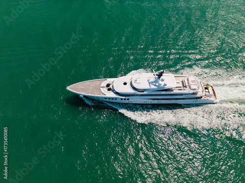 Yachting and boating marina. Yacht boat sailing. Aerial view luxury motorboat in sea. Summer sea vacation. Boat trip. Luxury lifestyle and traveling. Sea boat go to yacht marina. Endless sea