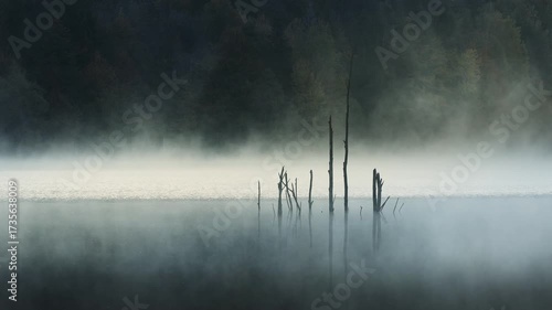  Spectacular sunrise on the lake. Mist rising from the water