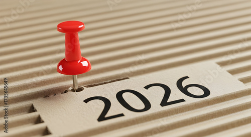 Marking the Year 2026 with a Red Pushpin on Corrugated Cardboard Background for Project Planning